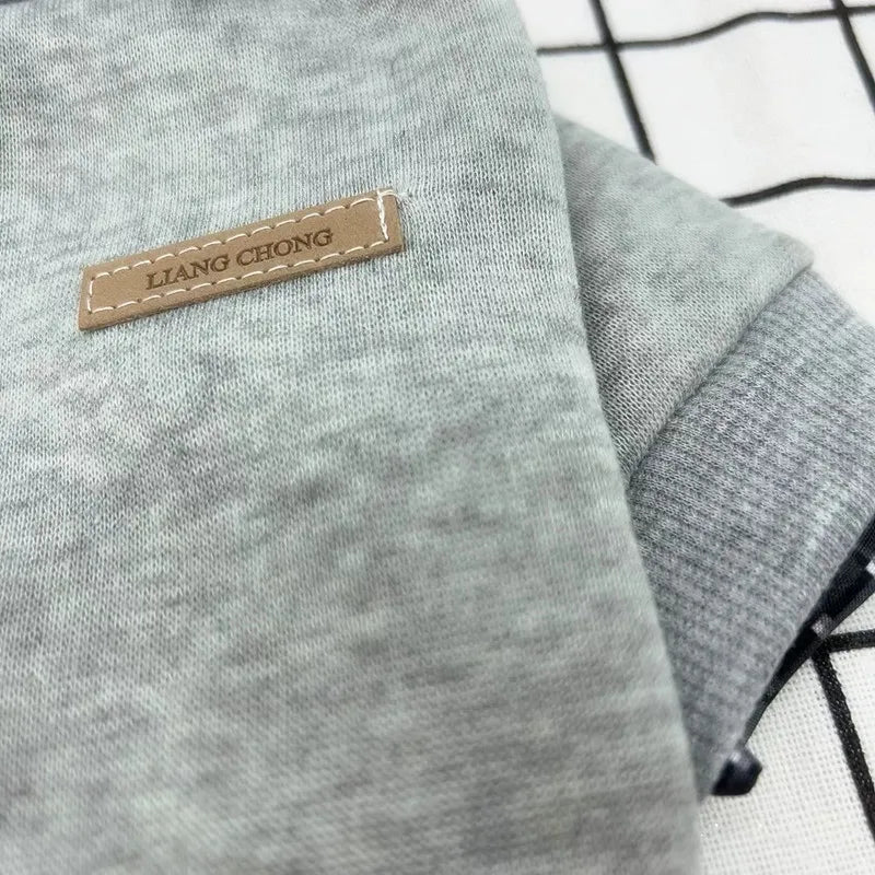 Gray fabric with a 'LIANG CHONG' label on a grid background